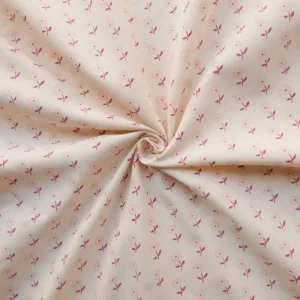 Tissu - Coton - Fond beige avec de petites fleurs aux teintes roses - 127 cm de diamètre